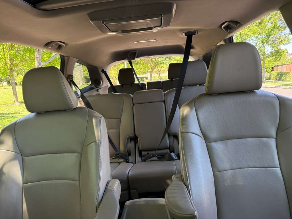 Beige leather interior of the Honda Pilot showing all three rows of seating